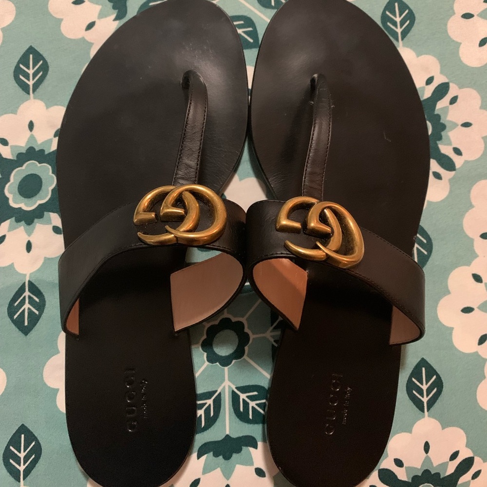 Black Gucci double G sandals.